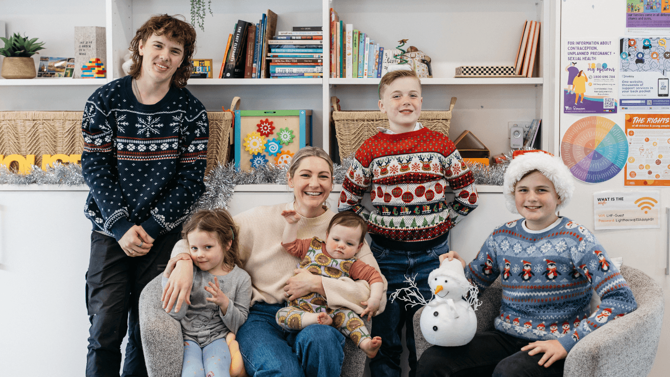 young people and parents in Christmas attire celebrating the holidays